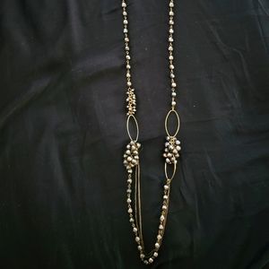 Long necklace in goldtone with silver beads accent